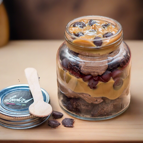 Chocolate Madness Jar. Layers of fudge brownie, toffee sauce, chunks of chocolate and our delicious chocolate mousse!  Size 200ml Enjoy our Jar cakes anywhere in Dubai. We offer delivery in DUbai, order online for delivery. 