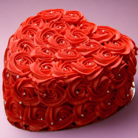 Red Colored Heart Shaped Floral Cake! Comes in a variety of flavors Chocolate Moist Milk Chocolate Red Velvet Carrot Cake Eggless Nutella.  We offer cake Delivery in Dubai. Order online for delivery. 