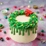 Christmas chocolate cake decorated with the buttercream Christmas wreath design